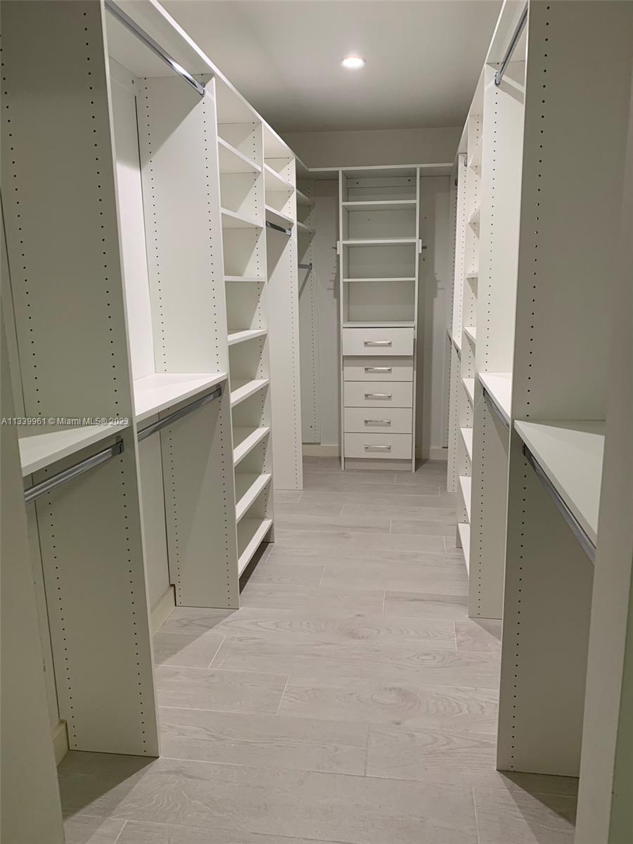 4033 South Le Jeune Road Miami, FL 33146 - Photo 14 of 24 a view of walk in closet with empty racks