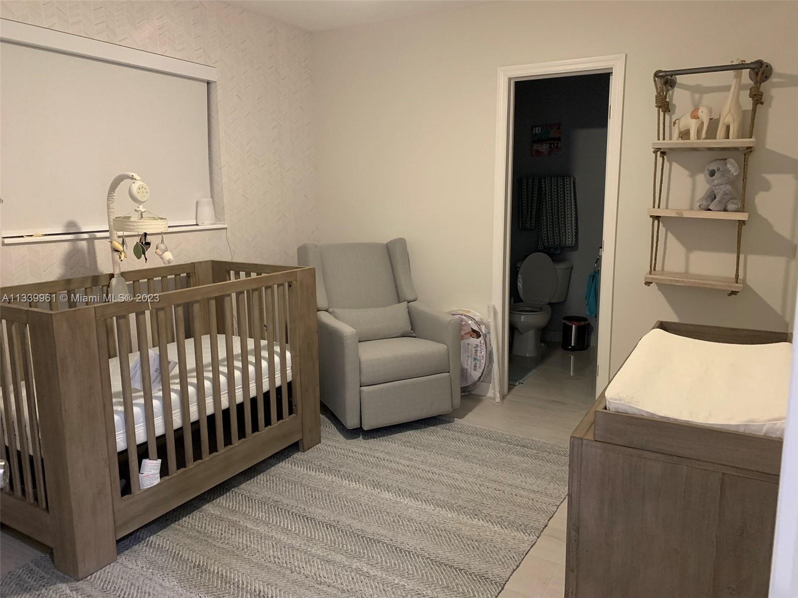 4033 South Le Jeune Road Miami, FL 33146 - Photo 15 of 24 a bedroom with furniture and a window