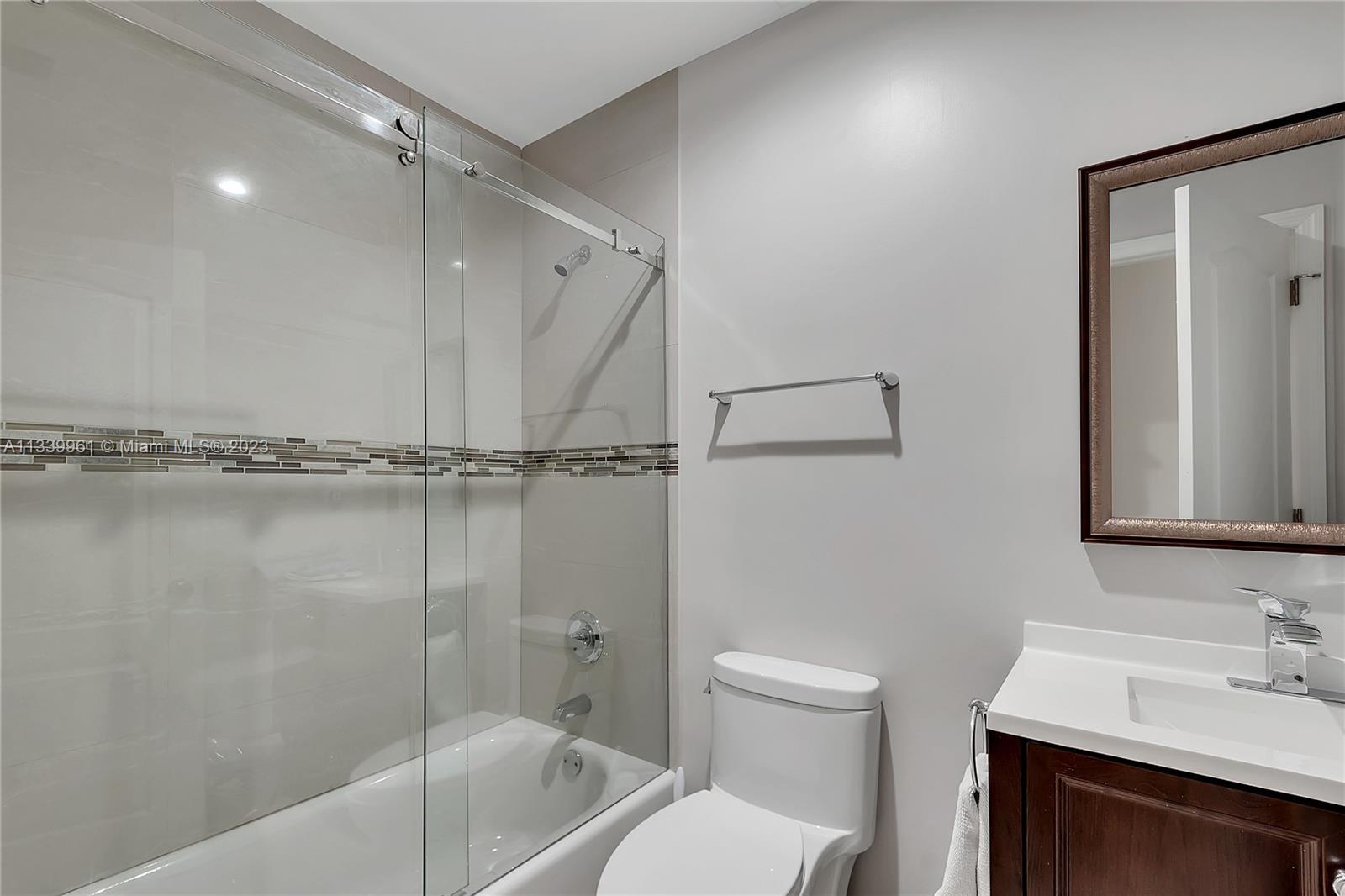4033 South Le Jeune Road Miami, FL 33146 - Photo 19 of 24 a bathroom with a sink a toilet and shower