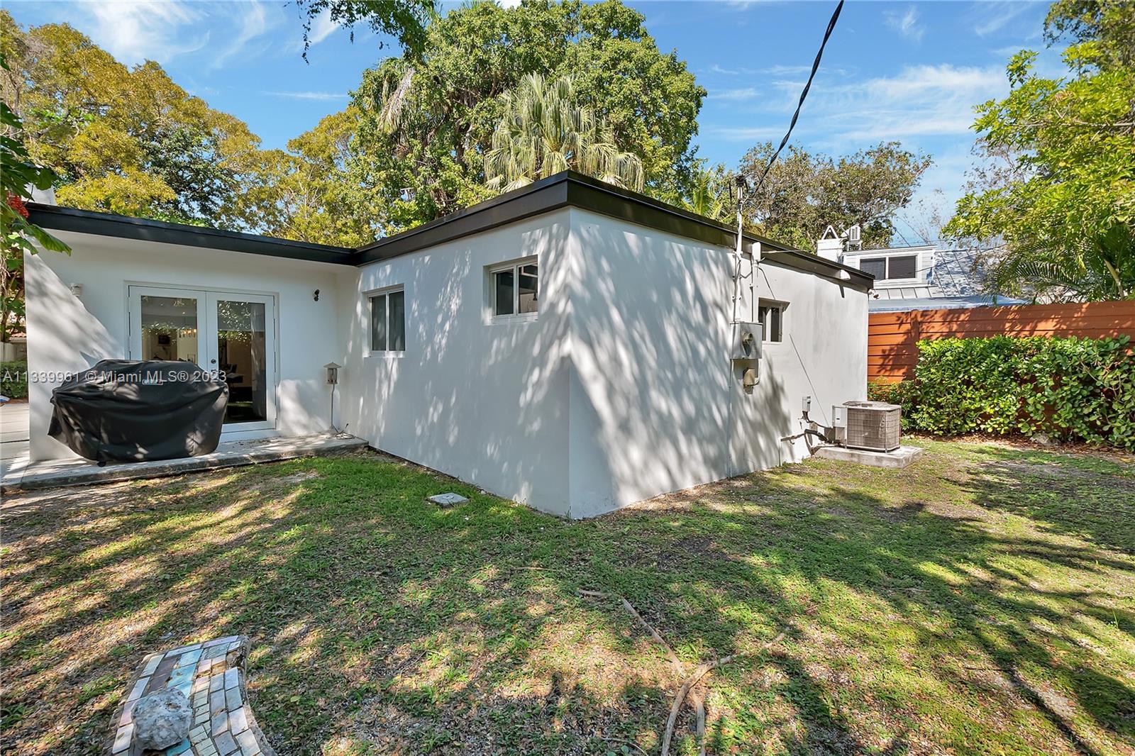 4033 South Le Jeune Road Miami, FL 33146 - Photo 21 of 24 a view of a house with backyard and a tree