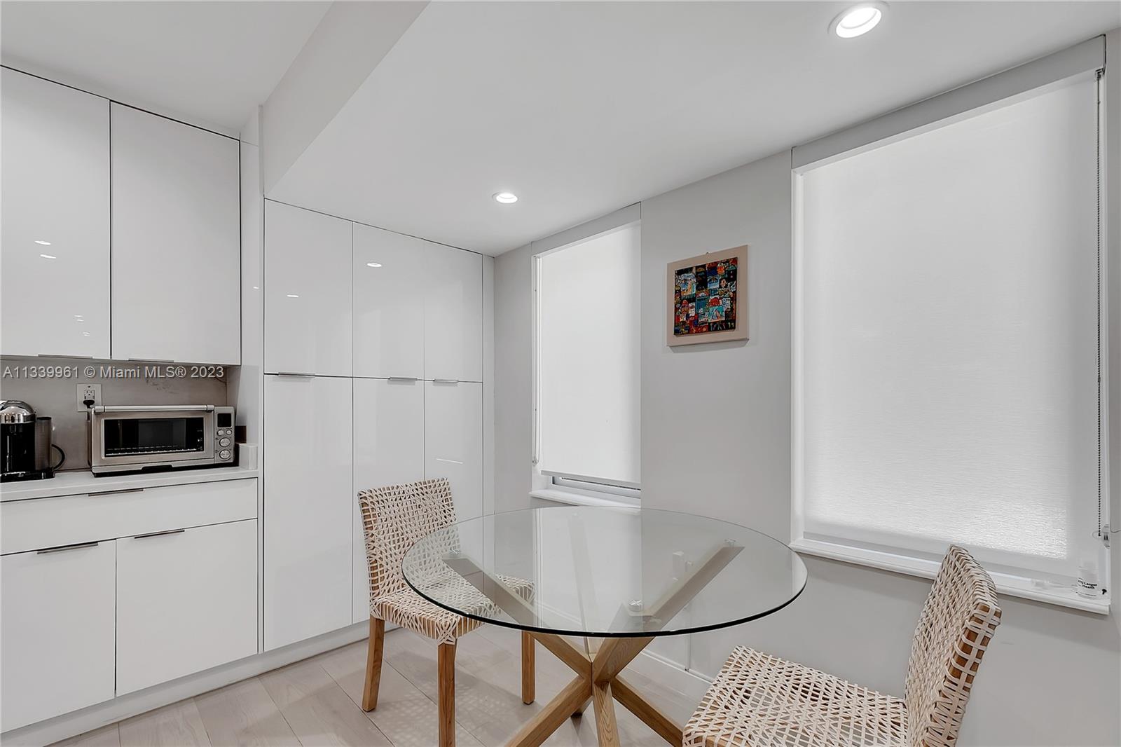 4033 South Le Jeune Road Miami, FL 33146 - Photo 7 of 24 a view of a kitchen with furniture and wooden floor