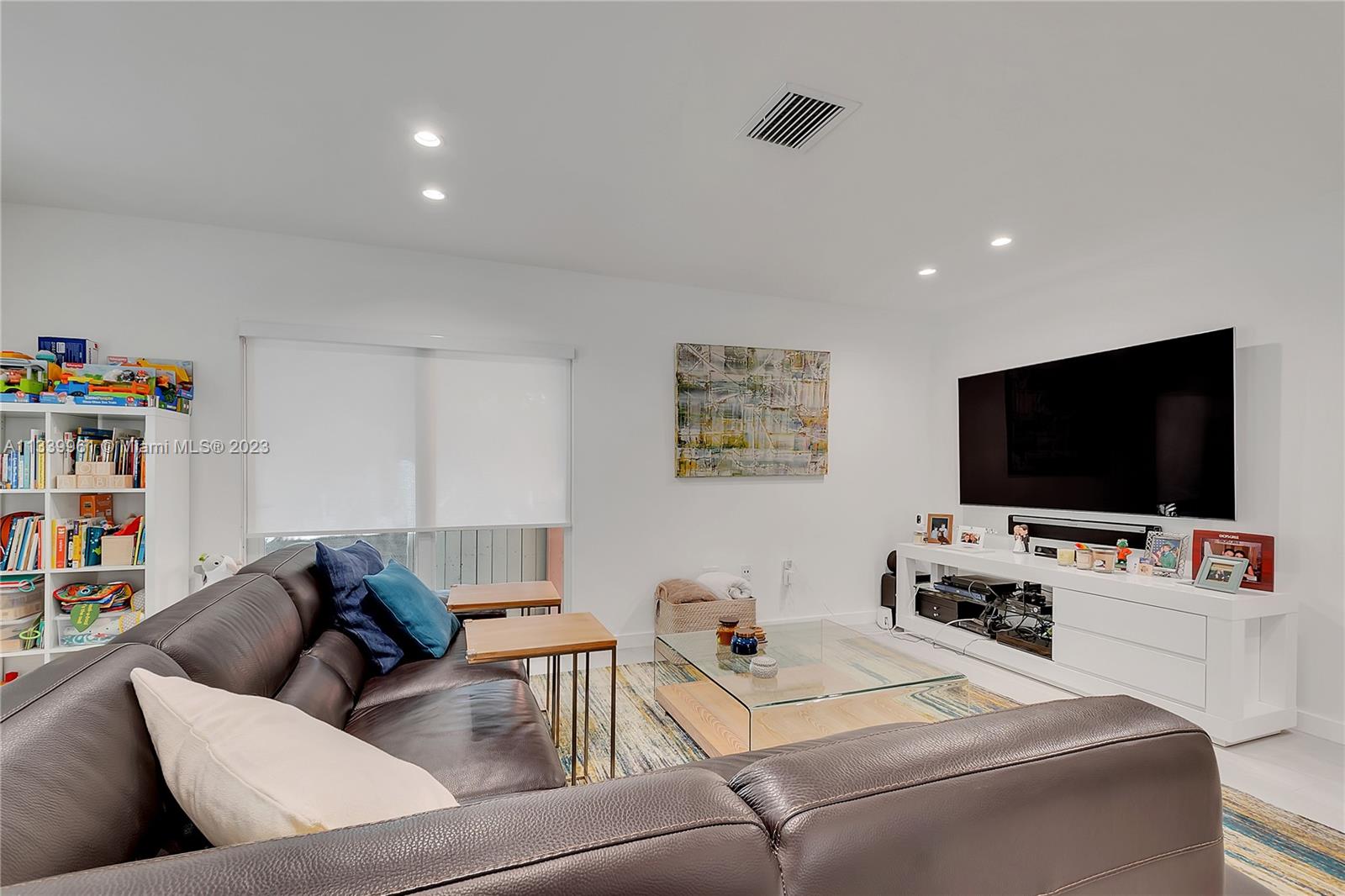 4033 South Le Jeune Road Miami, FL 33146 - Photo 9 of 24 a living room with furniture and a flat screen tv