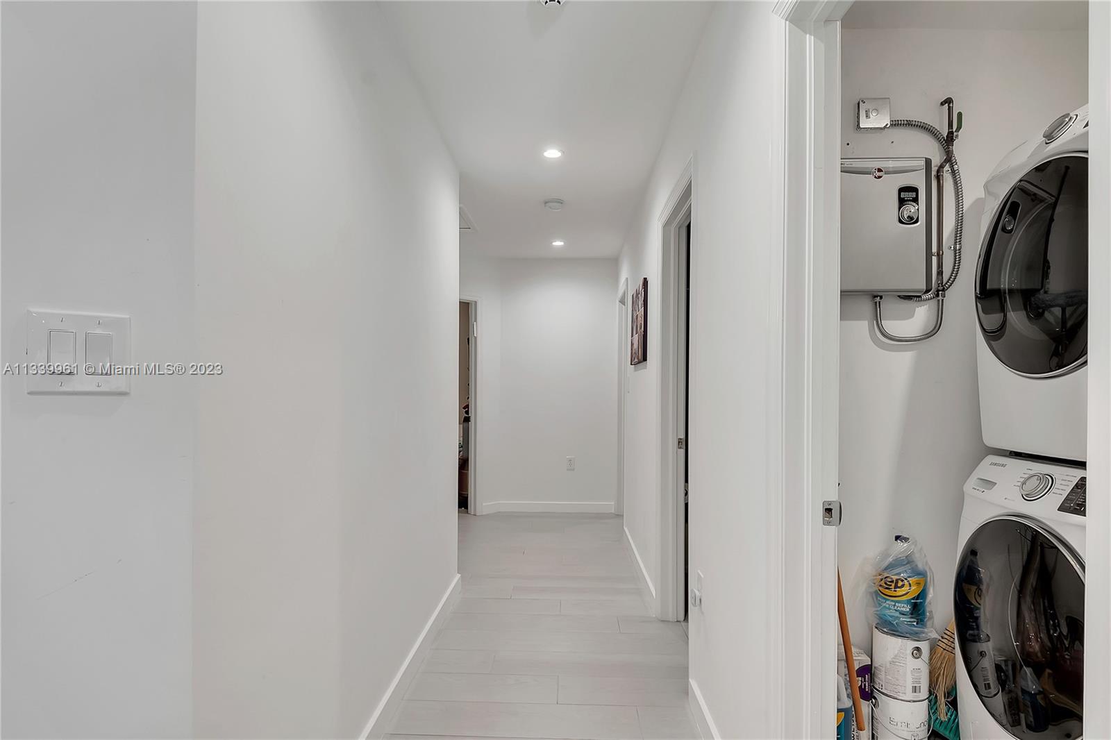 4033 South Le Jeune Road Miami, FL 33146 - Photo 10 of 24 a view of a hallway with washer and dryer