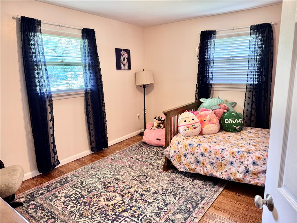 5334 Egypt Road Laurys Station, PA 18059 - Photo 26 of 55 Well-lit sleeping quarters with natural hardwood flooring and multiple windows.