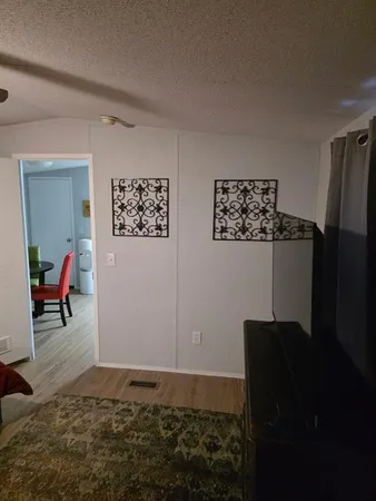 a bedroom with a bed and a table in it