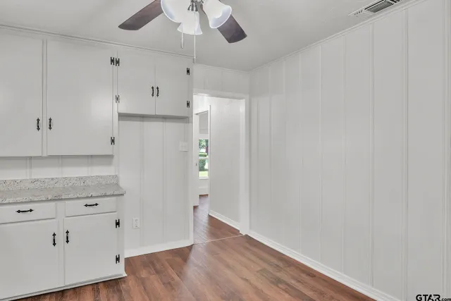 a view of a kitchen with wooden floor