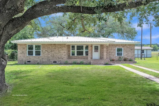 a house view with a garden space