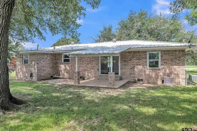 a backyard of a house with seating space