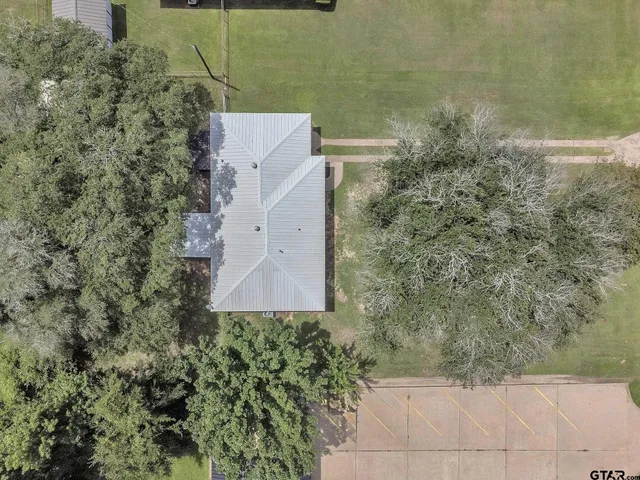 a aerial view of a house with a yard