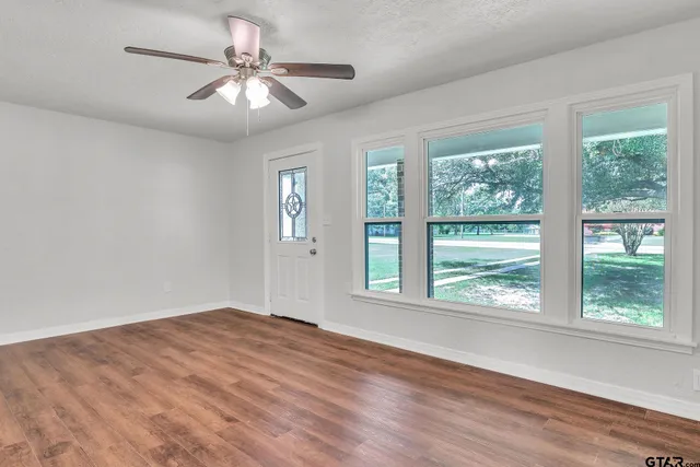 a view of an empty room with a window