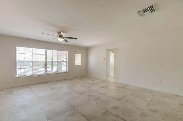 a view of a kitchen with a sink and cabinets