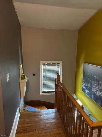 a view of an entryway with wooden floor