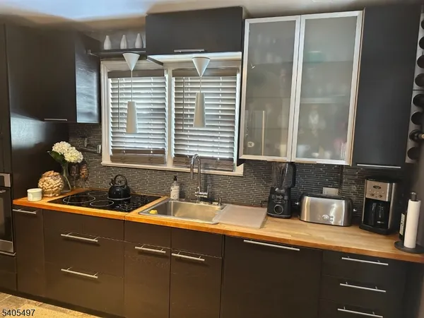 a kitchen with a sink and a window