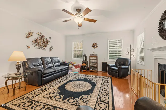 a kitchen with stainless steel appliances granite countertop a stove a sink dishwasher and a refrigerator with wooden cabinets