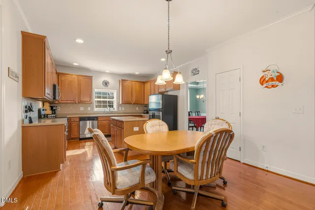 a kitchen with granite countertop cabinets stainless steel appliances and a sink