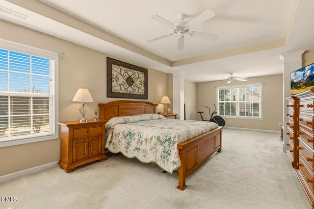 a bedroom with a bed and a table in it