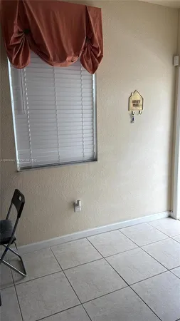 a view of storage and utility room with two washing machine