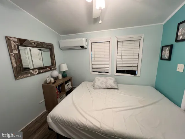 a view of a room with table and chairs