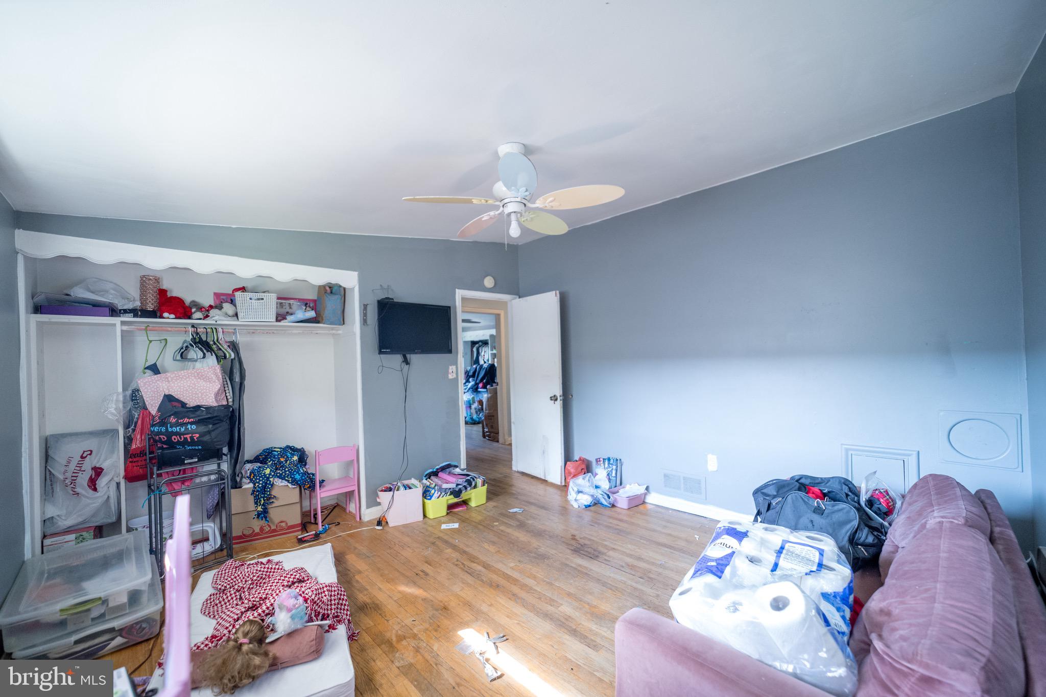 4125 Ronis Road Pikesville, MD 21208 - Photo 9 of 40 a bedroom with furniture and a chandelier
