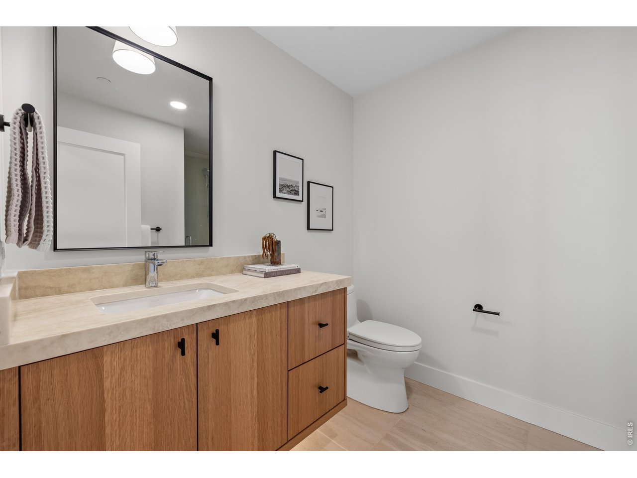 9578 Mountain Ridge Drive Boulder, CO 80302 - Photo 40 of 47 a bathroom with a granite countertop sink a toilet and a mirror