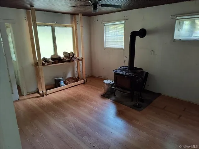 a view of room with hardwood floor and window