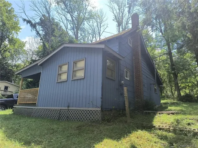a backyard of a house with lots of green space