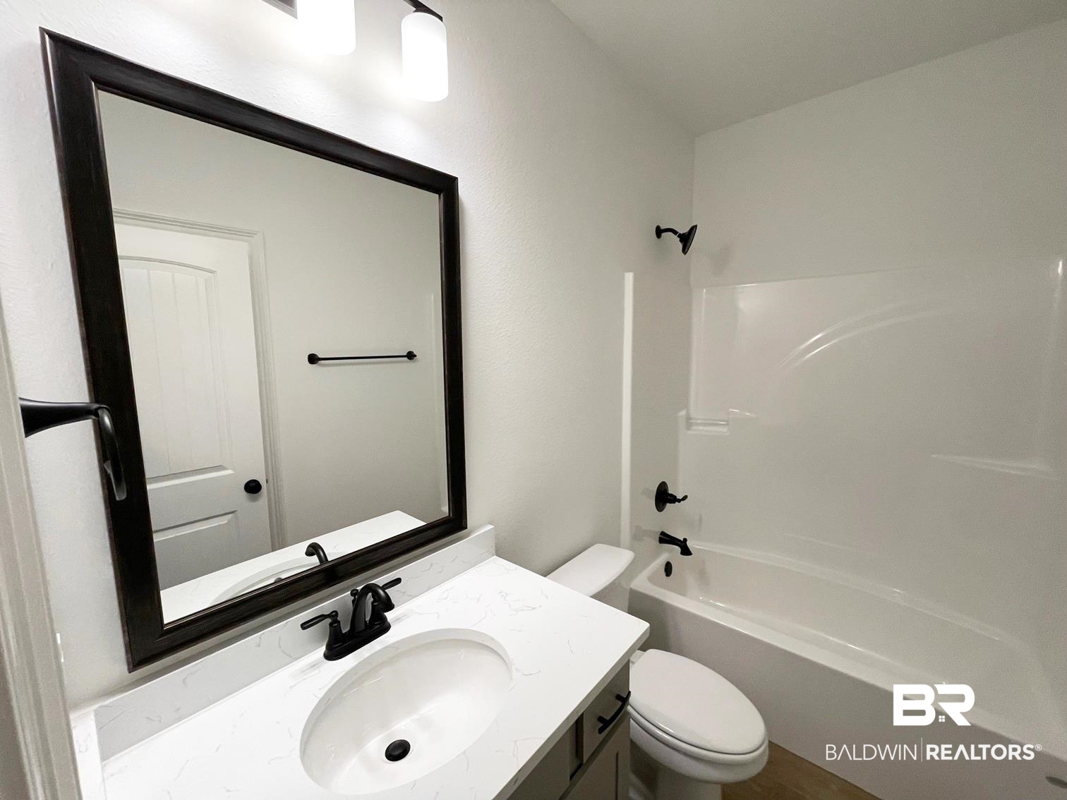 1403 Fenton Circle Foley, AL 36535 - Photo 11 of 15 Full bathroom featuring bathing tub / shower combination, vanity, and toilet