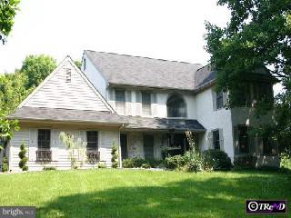 a view of a house with garden and porch