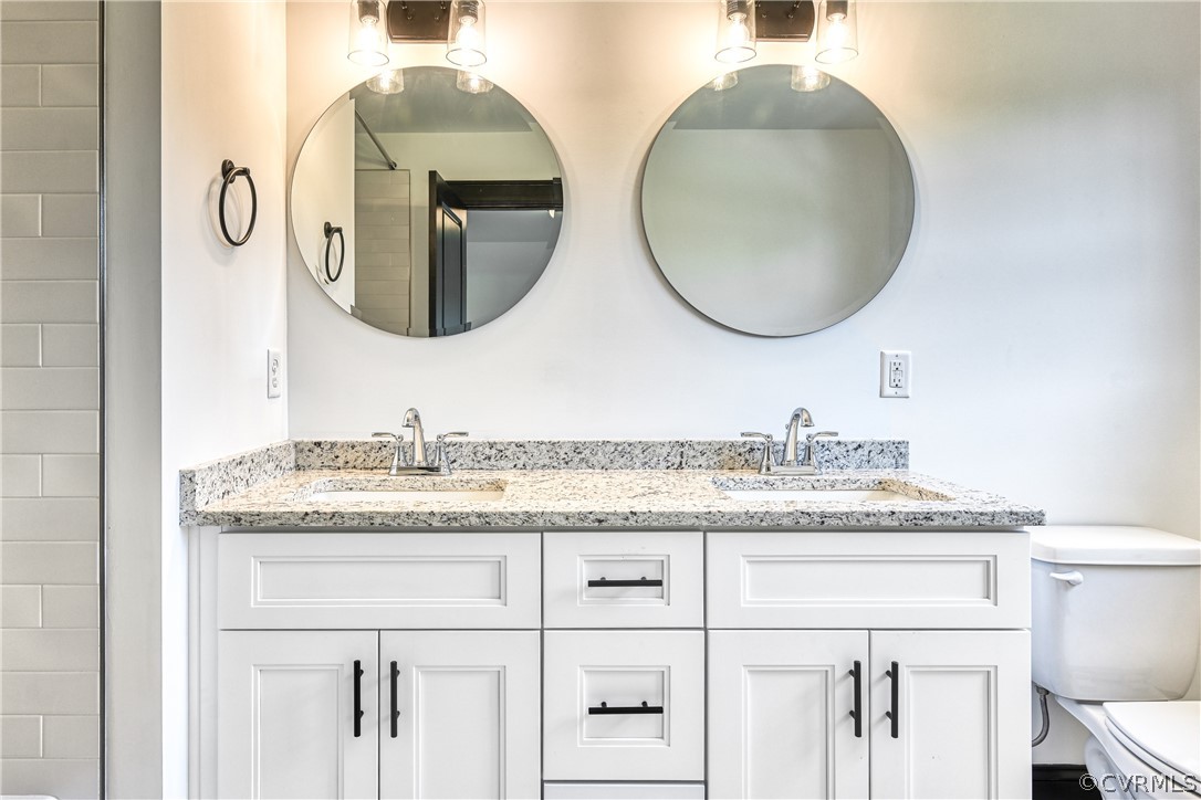 694 Gardners Road Mineral, VA 23117 - Photo 25 of 41 a bathroom with a granite countertop double vanity sink and mirror
