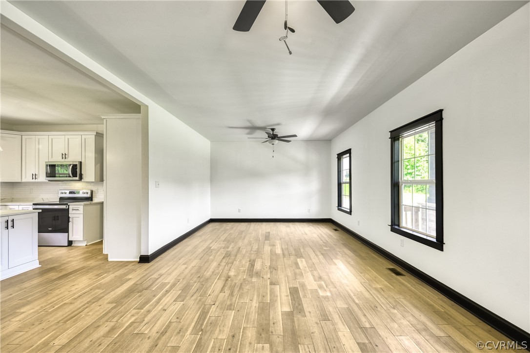 694 Gardners Road Mineral, VA 23117 - Photo 8 of 41 wooden floor in an empty room with a kitchen