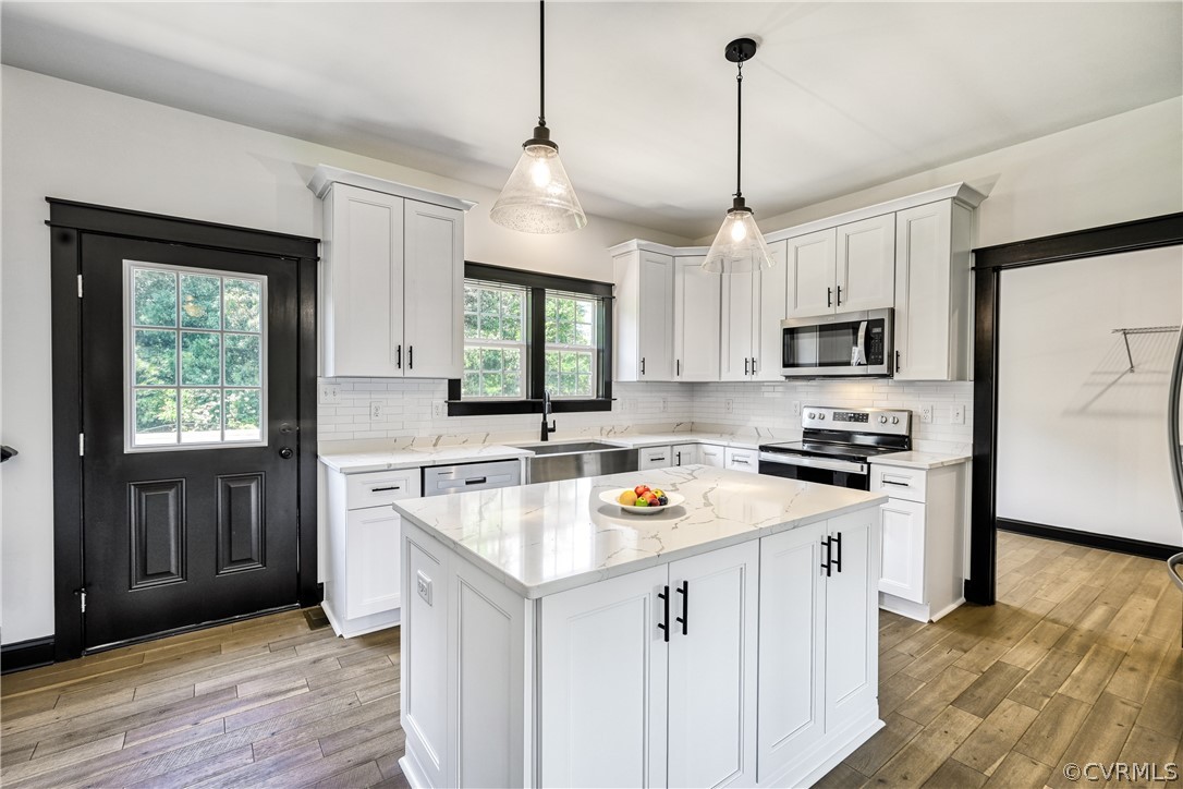 694 Gardners Road Mineral, VA 23117 - Photo 10 of 41 a kitchen with stainless steel appliances granite countertop a sink stove a refrigerator a center island with wooden floor