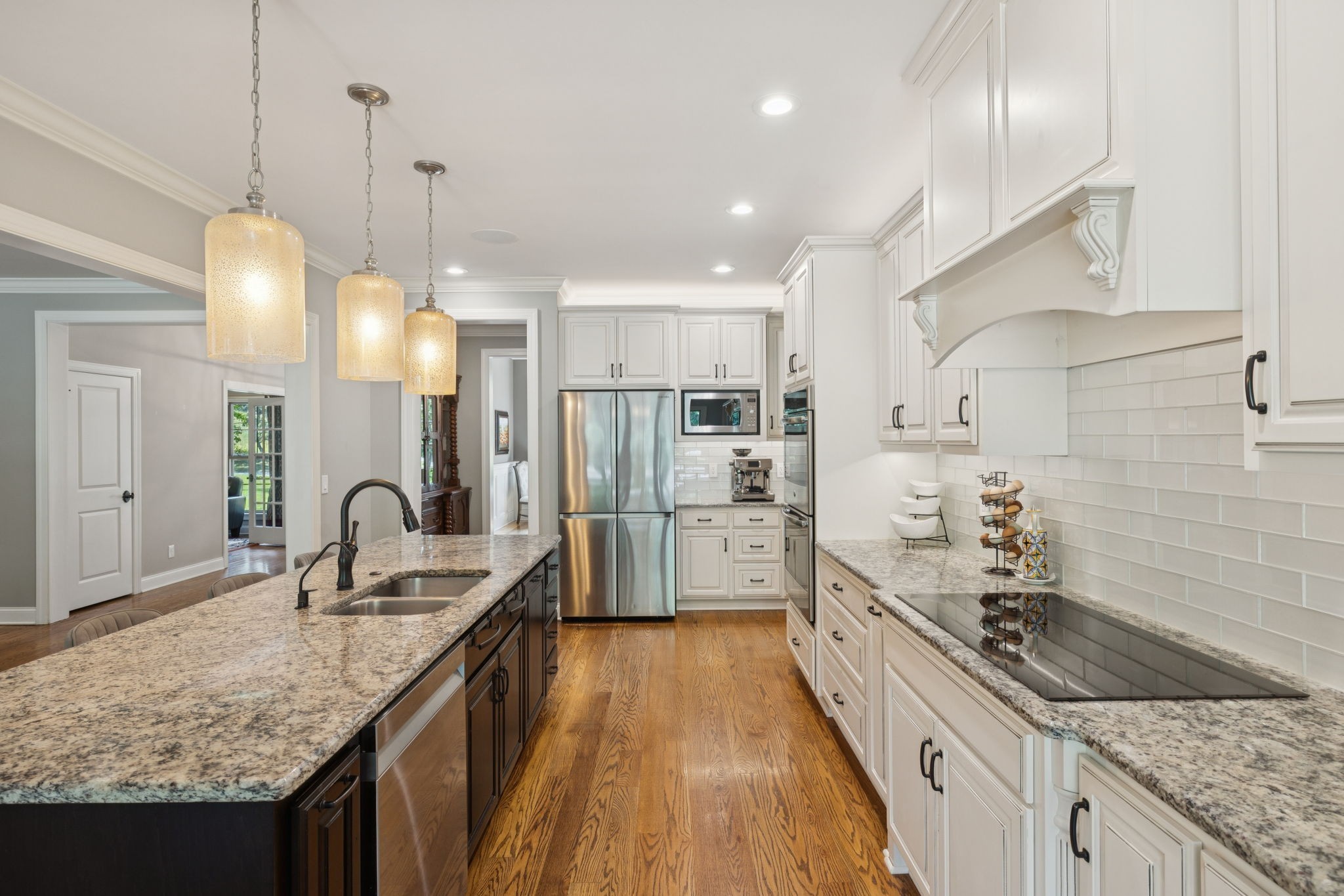 7270 Old Franklin Road Fairview, TN 37062 - Photo 22 of 96 a kitchen with granite countertop a sink a counter space appliances and cabinets