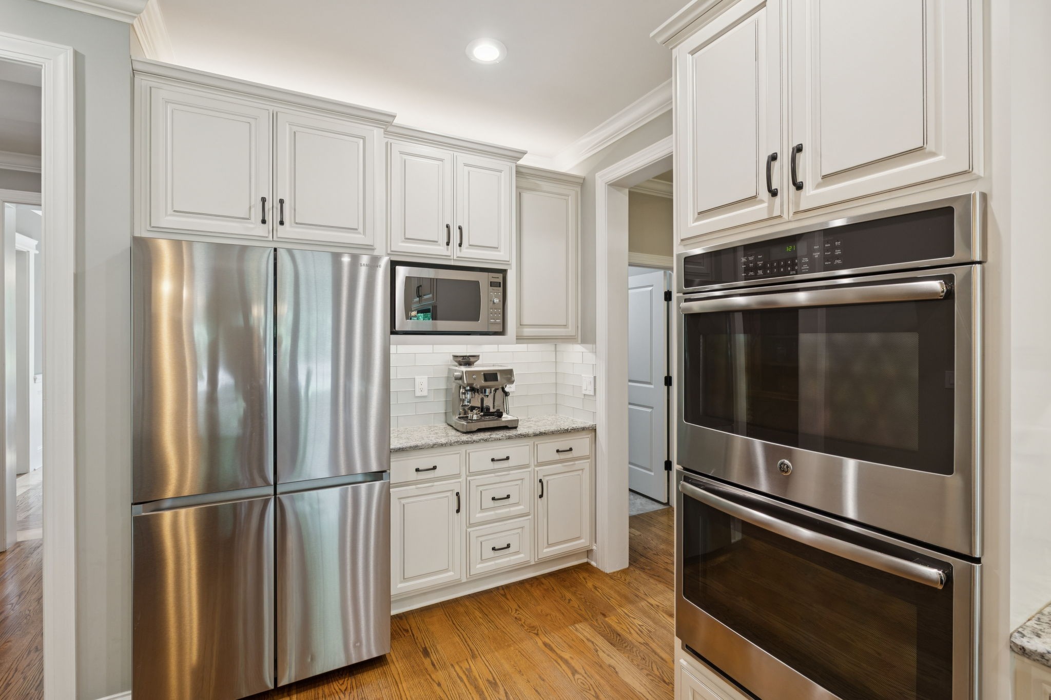 7270 Old Franklin Road Fairview, TN 37062 - Photo 24 of 96 a kitchen with stainless steel appliances and white cabinets