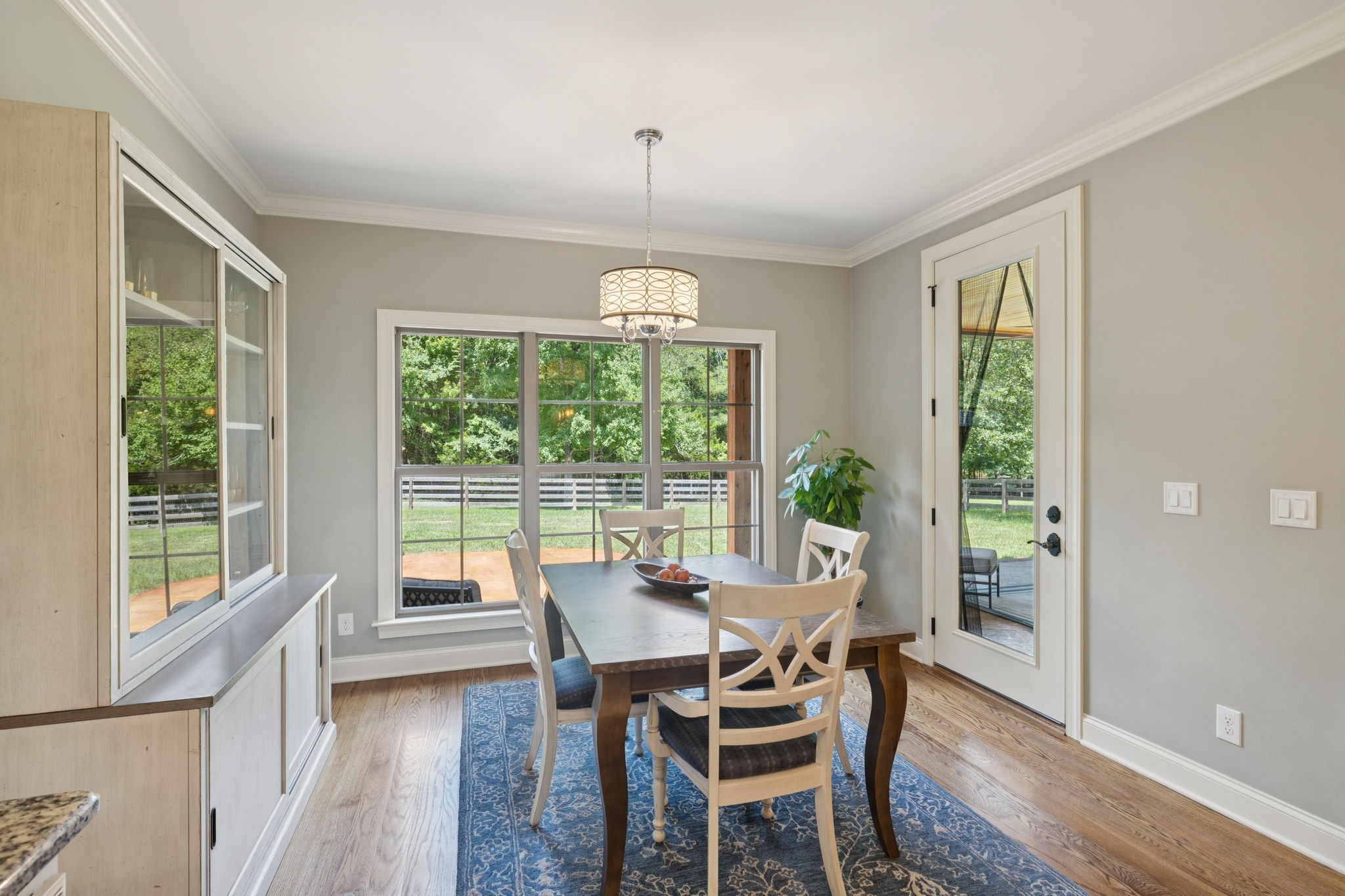 7270 Old Franklin Road Fairview, TN 37062 - Photo 26 of 96 a dining room with furniture window outside view and wooden floor