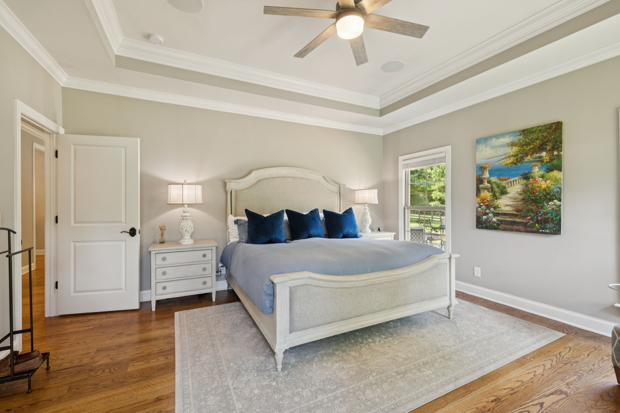 7270 Old Franklin Road Fairview, TN 37062 - Photo 31 of 96 a spacious bedroom with a bed and a chandelier