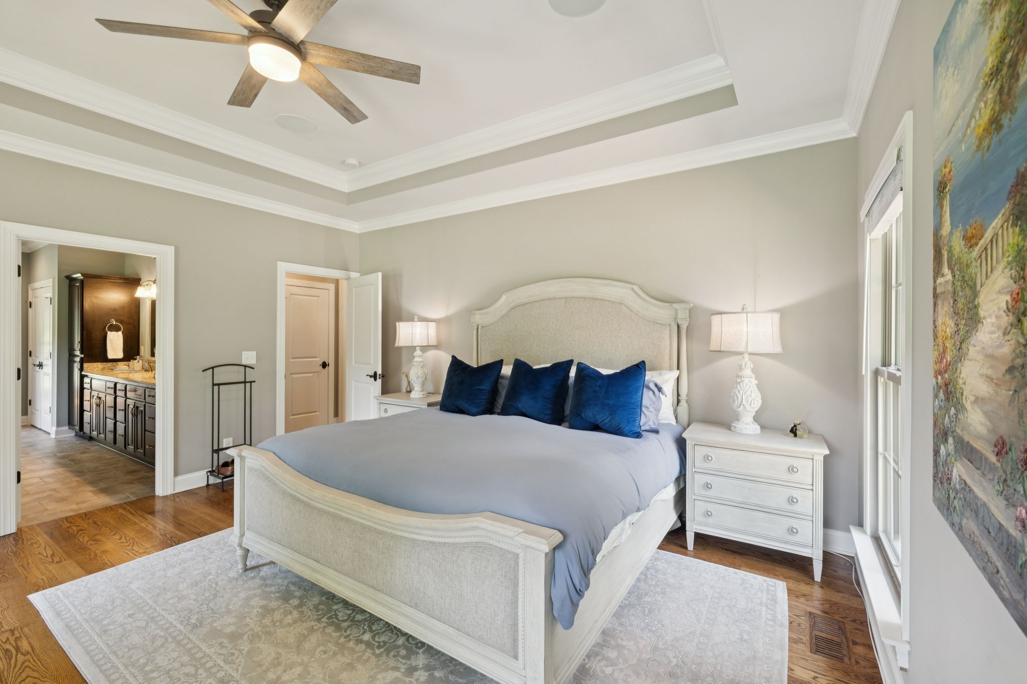 7270 Old Franklin Road Fairview, TN 37062 - Photo 34 of 96 a bedroom with a bed and a chandelier