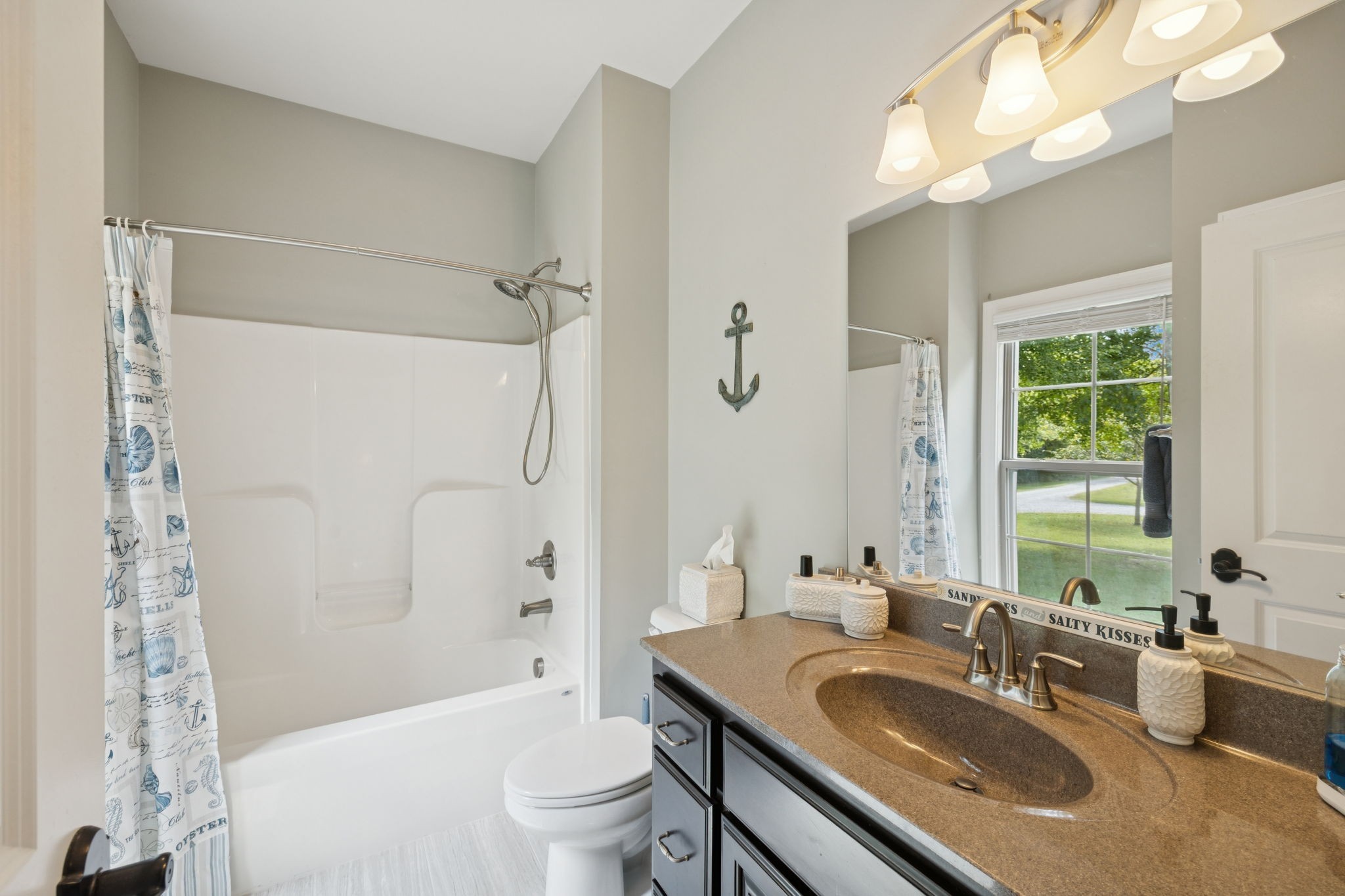7270 Old Franklin Road Fairview, TN 37062 - Photo 42 of 96 a bathroom with a granite countertop double vanity sink toilet mirror and shower
