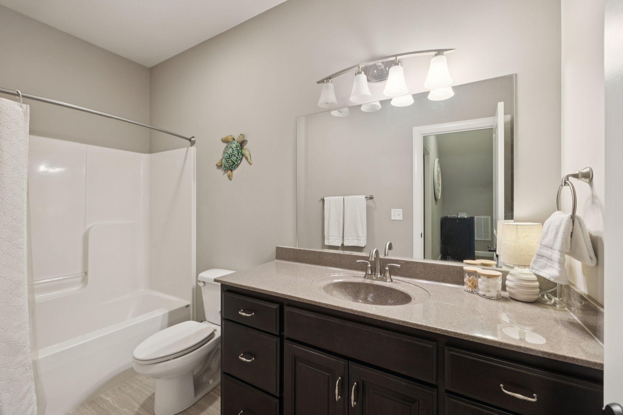 7270 Old Franklin Road Fairview, TN 37062 - Photo 46 of 96 a bathroom with a granite countertop sink a toilet and a mirror