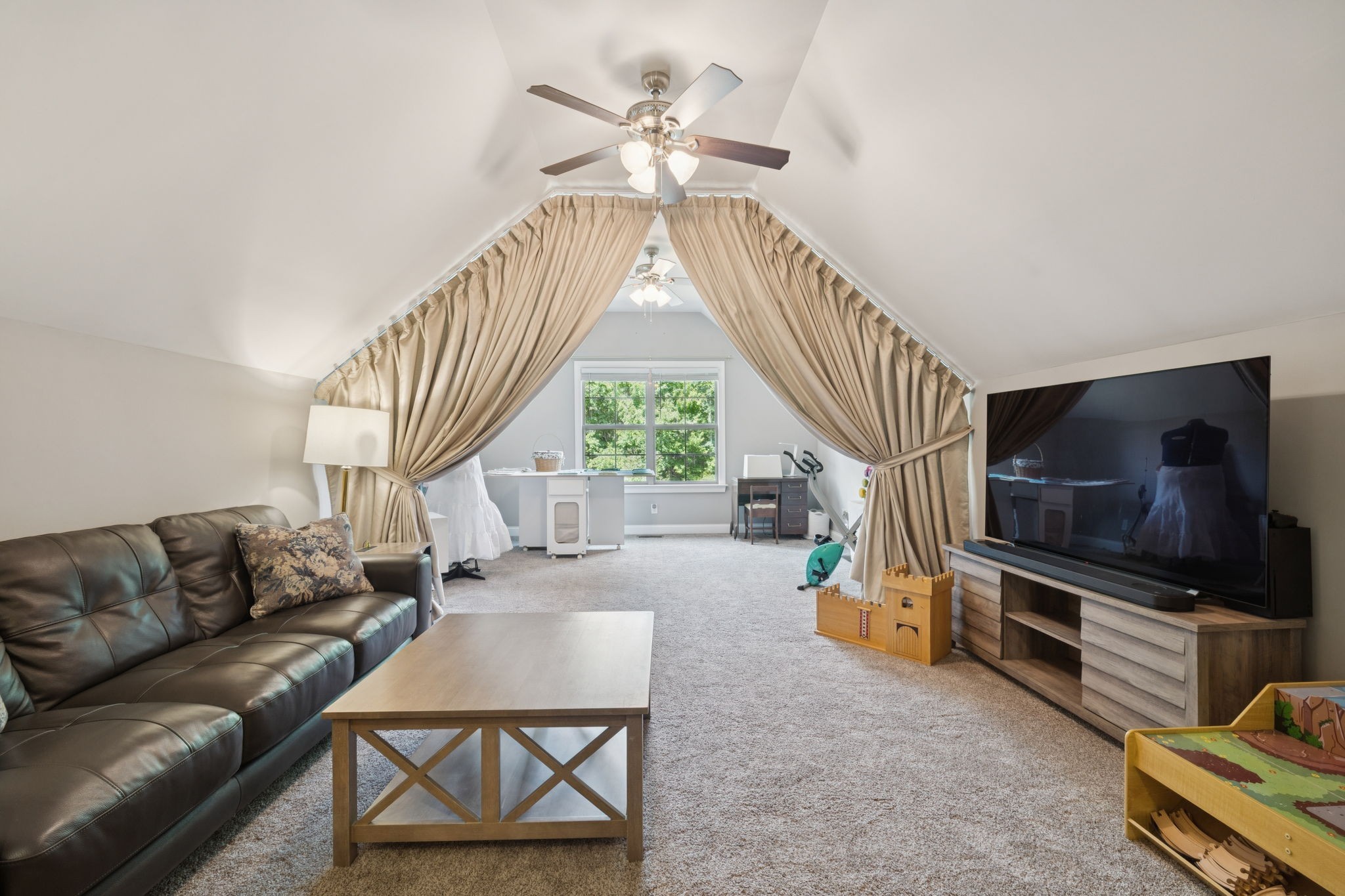 7270 Old Franklin Road Fairview, TN 37062 - Photo 50 of 96 a living room with furniture a flat screen tv and a window
