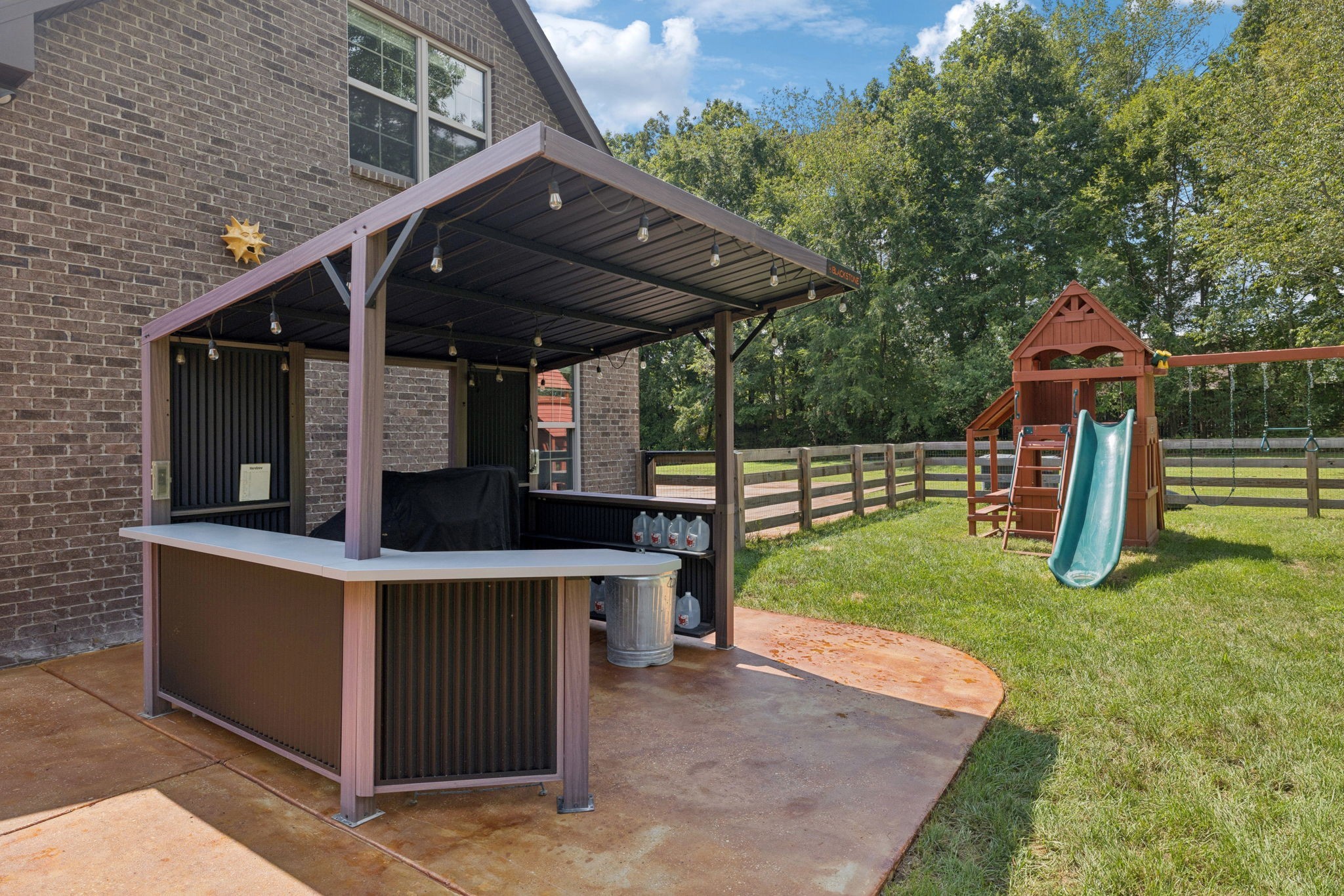 7270 Old Franklin Road Fairview, TN 37062 - Photo 63 of 96 a view of a backyard with a sink and a wooden deck