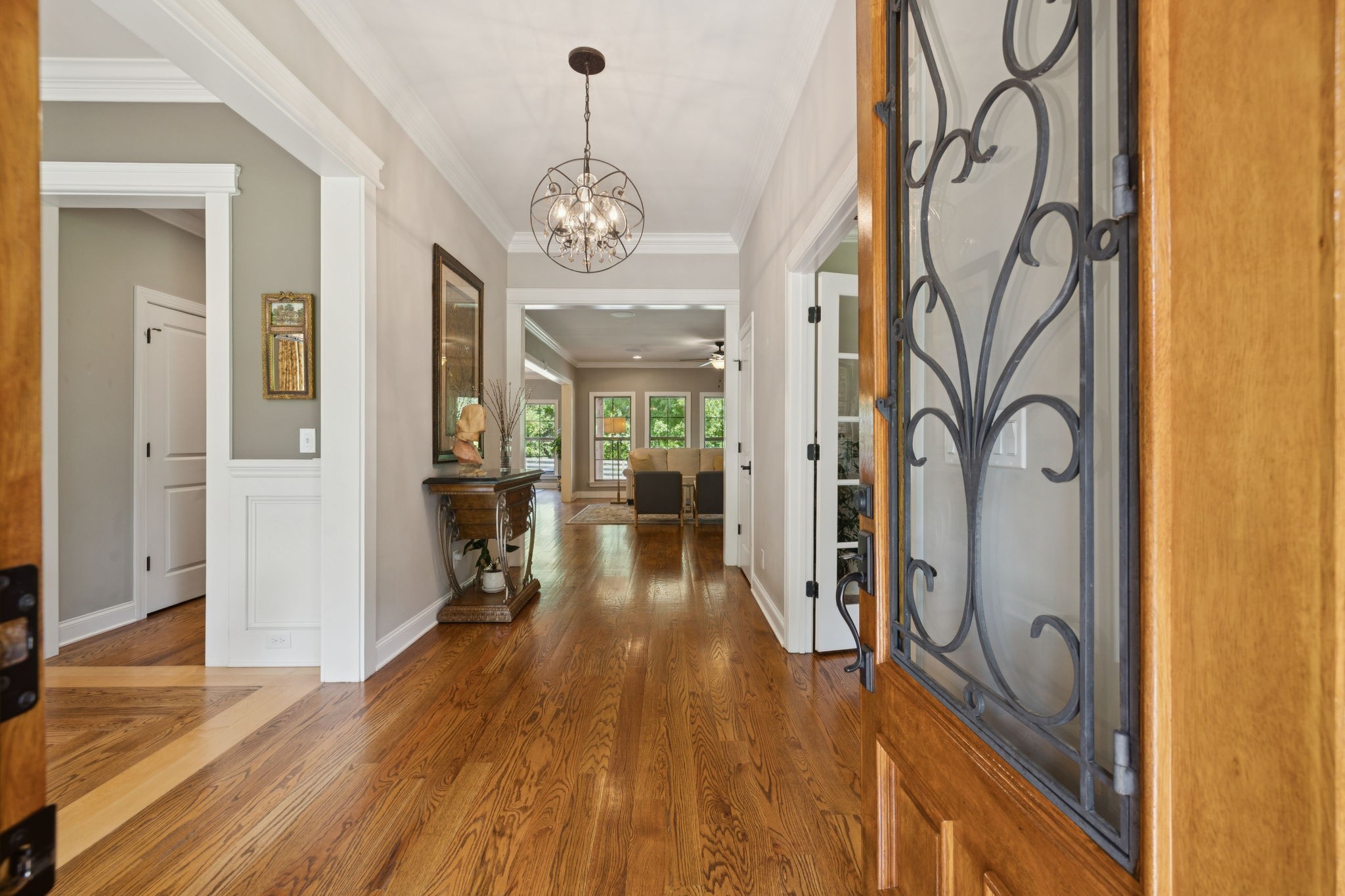 7270 Old Franklin Road Fairview, TN 37062 - Photo 9 of 96 a view of a hallway with wooden floor and a kitchen