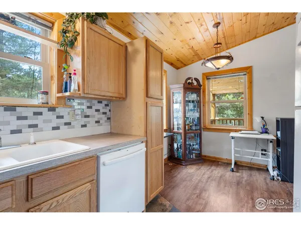 a kitchen that has a cabinets and a stove