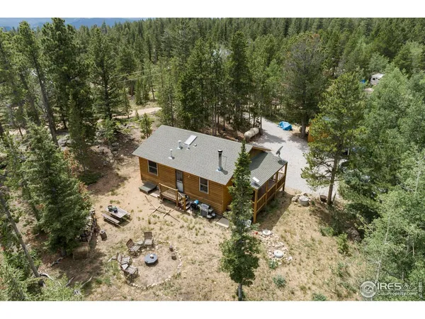 a aerial view of a house with a yard