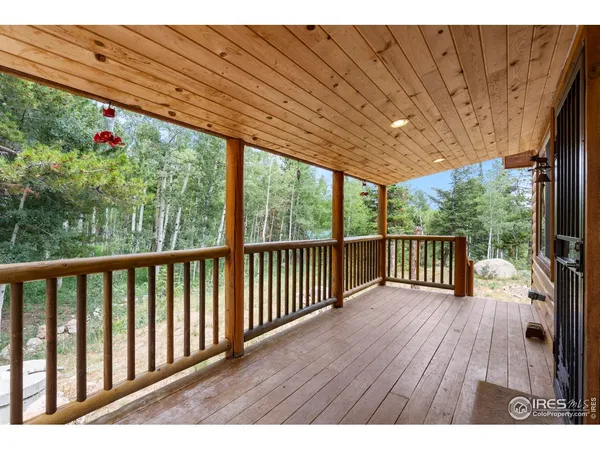 a view of porch with wooden floor