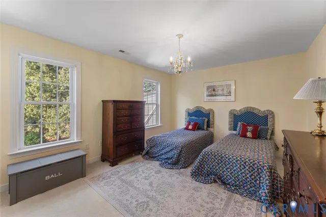 a bedroom with bed and window