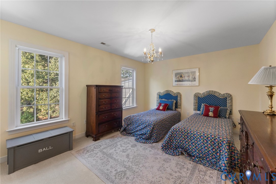 480 Rockingham Road Dunnsville, VA 22454 - Photo 31 of 41 a bedroom with bed and window