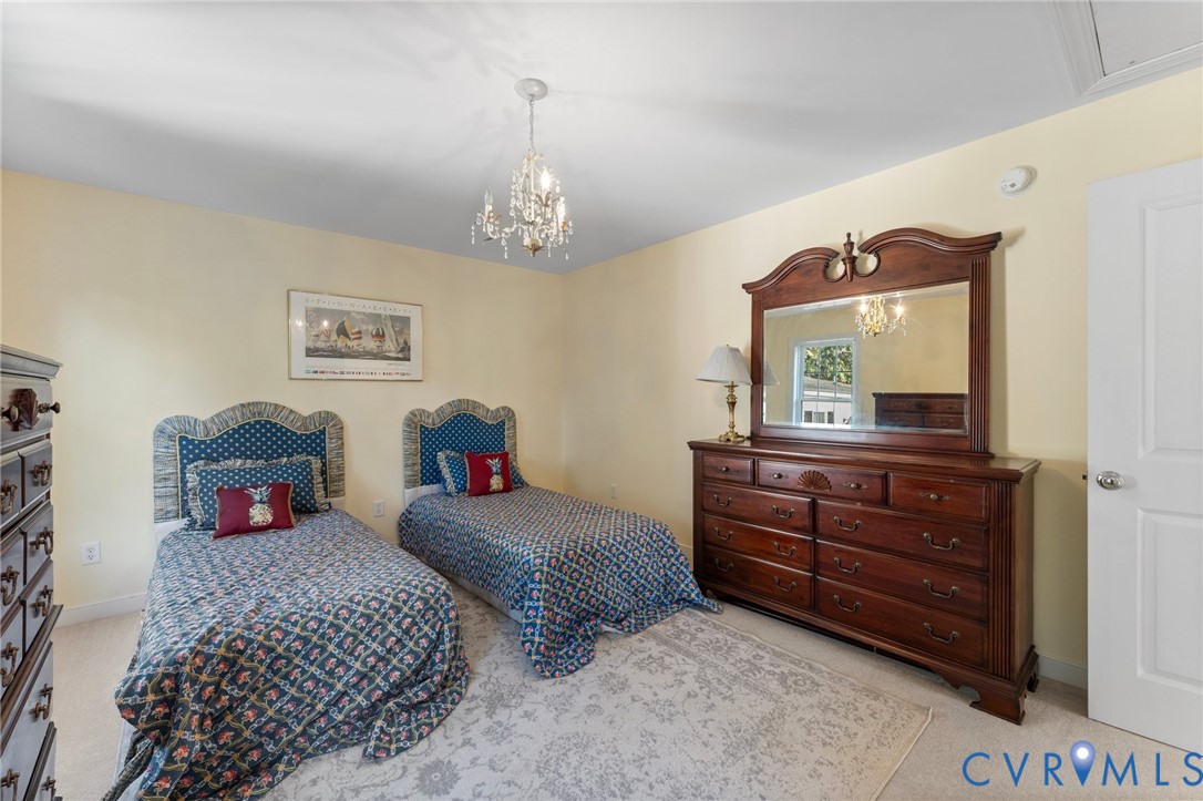 480 Rockingham Road Dunnsville, VA 22454 - Photo 32 of 41 a bedroom with a bed and a dresser