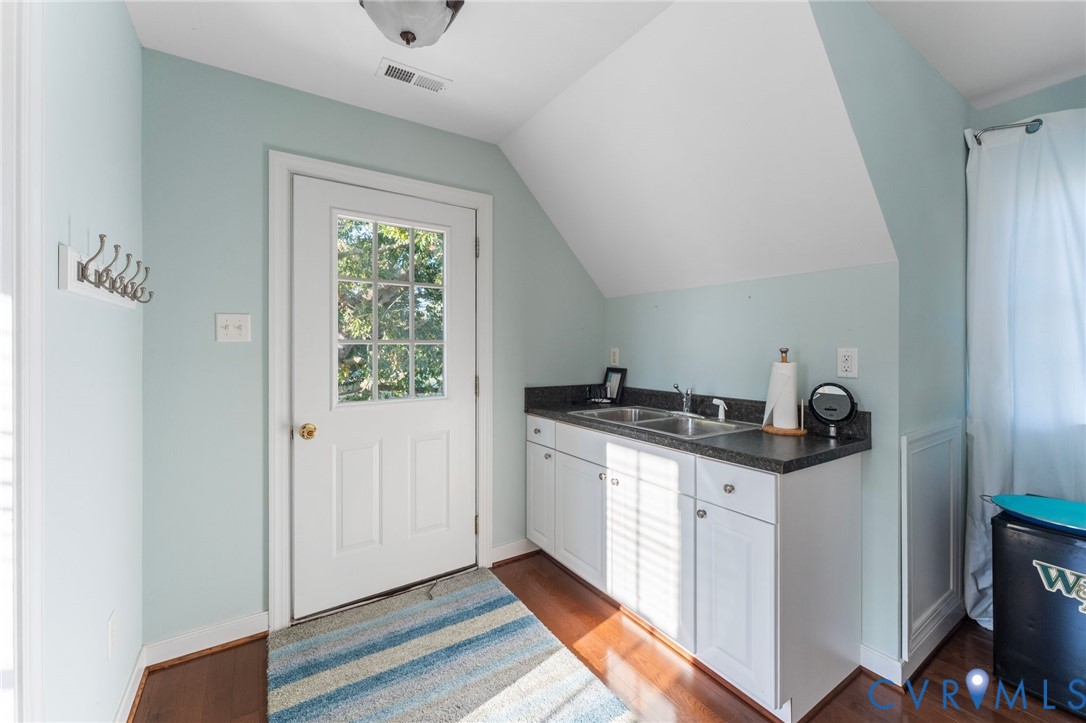480 Rockingham Road Dunnsville, VA 22454 - Photo 39 of 41 a kitchen with stainless steel appliances granite countertop a stove and a sink