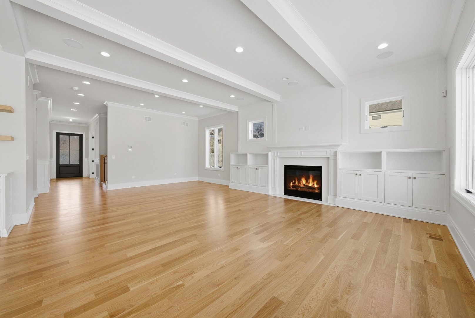 611 South Prospect Avenue Elmhurst, IL 60126 - Photo 12 of 28 a view of an empty room with wooden floor and a fireplace