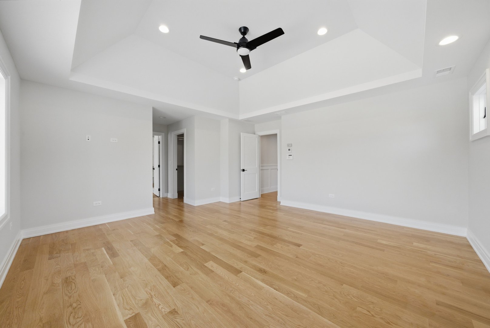 611 South Prospect Avenue Elmhurst, IL 60126 - Photo 14 of 28 wooden floor in an empty room with a ceiling fan